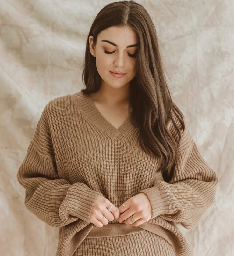 A natural-looking young woman wearing a matching knit set styled for an effortless look. Theme thanksgiving outfit