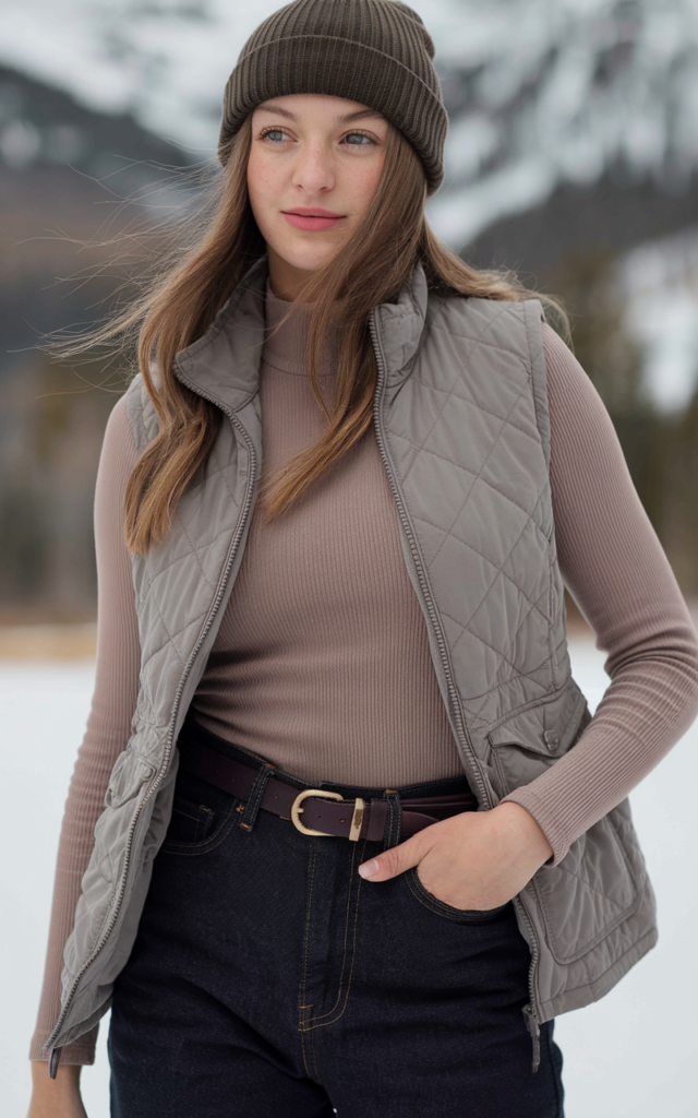 Belt a quilted vest over a thermal top and straight jeans