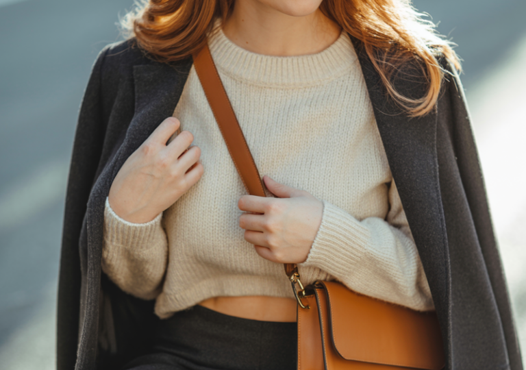 Combine a midi skirt with a cropped sweater and ankle boots.