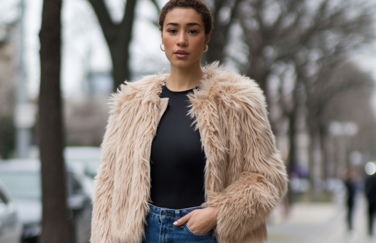 Layer a faux fur jacket over a fitted bodysuit and straight jeans.