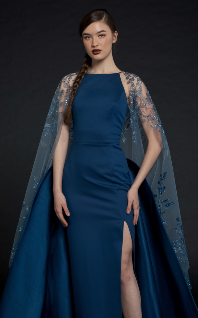 Make an entrance in a dramatic cape prom dress