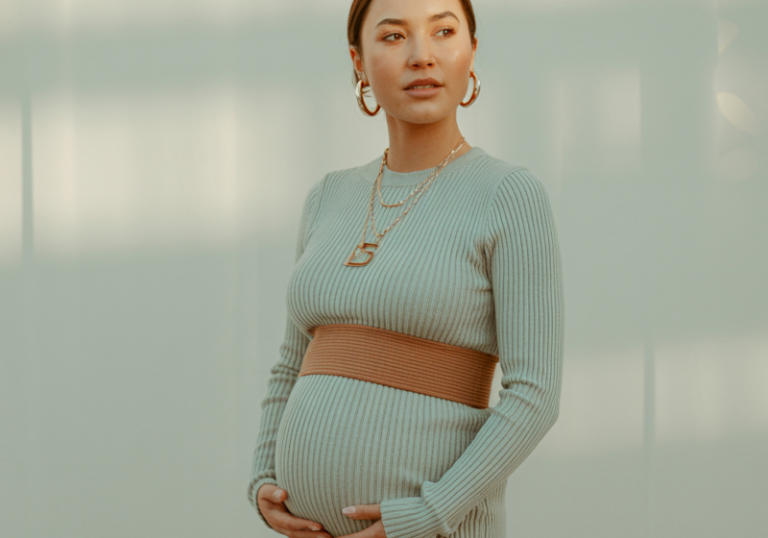 Style a ribbed knit midi dress with a statement belt.