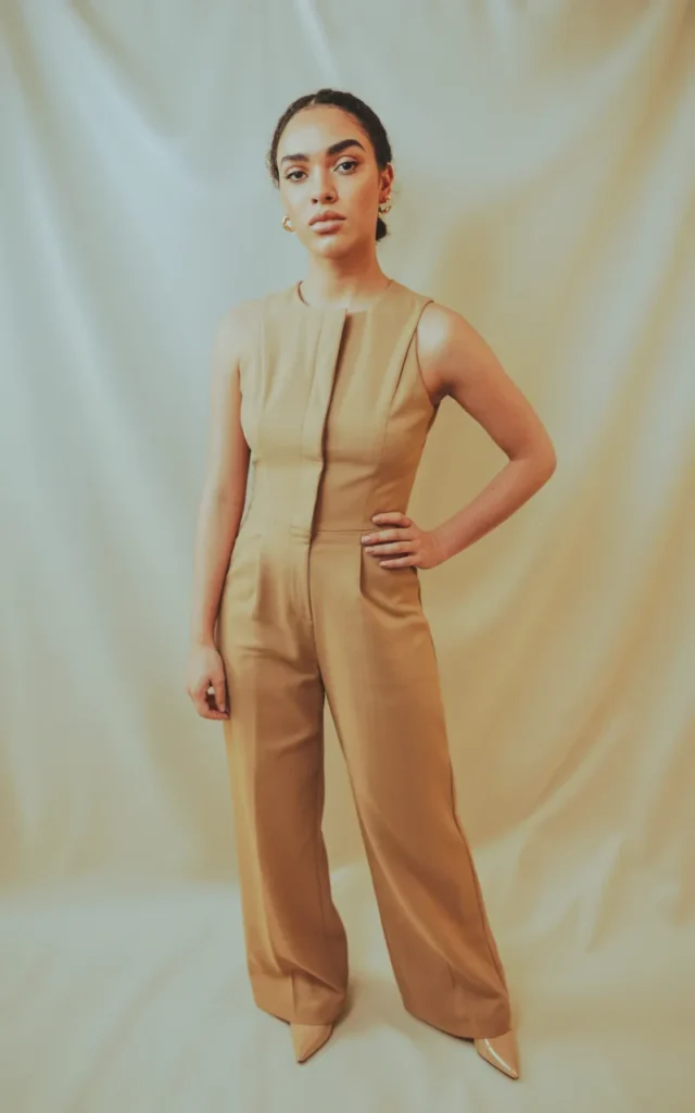 Pair a structured jumpsuit with minimal accessories