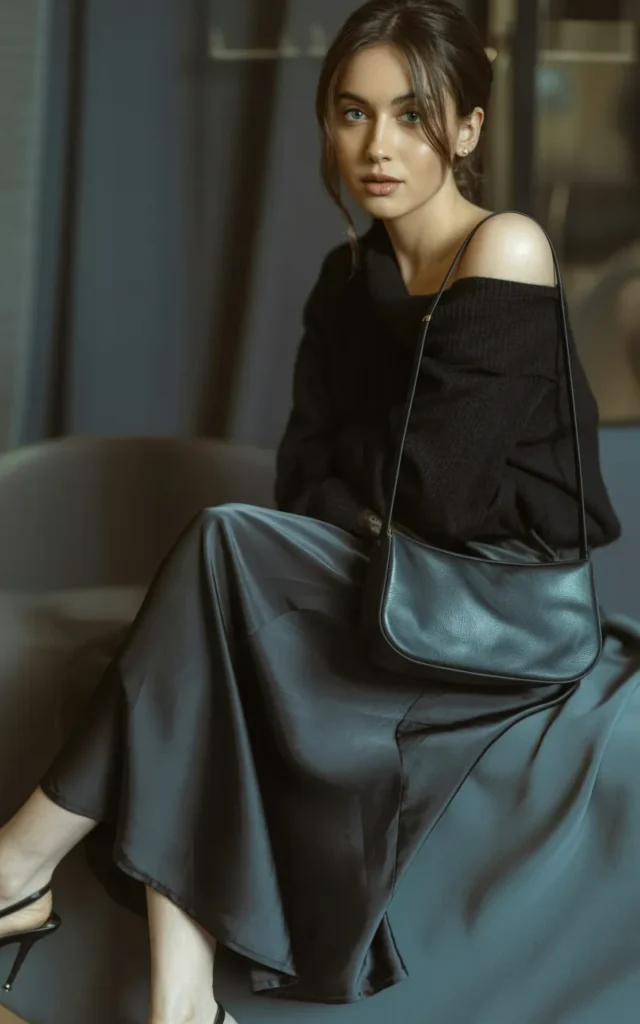 Wear a black slip skirt with an off-shoulder sweater.
