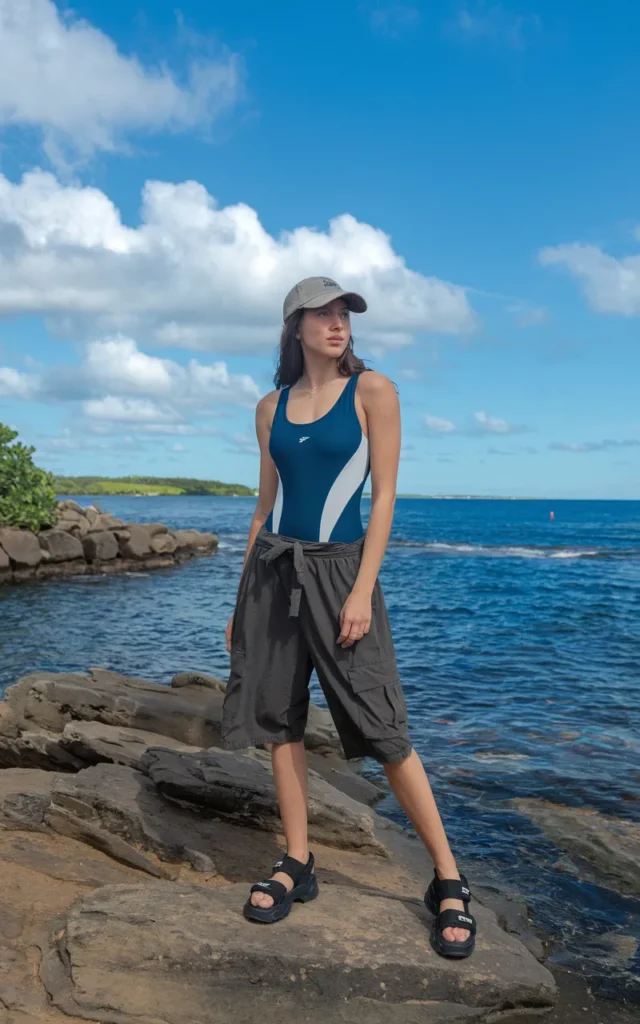 Wear a sporty one-piece with relaxed cargo shorts.