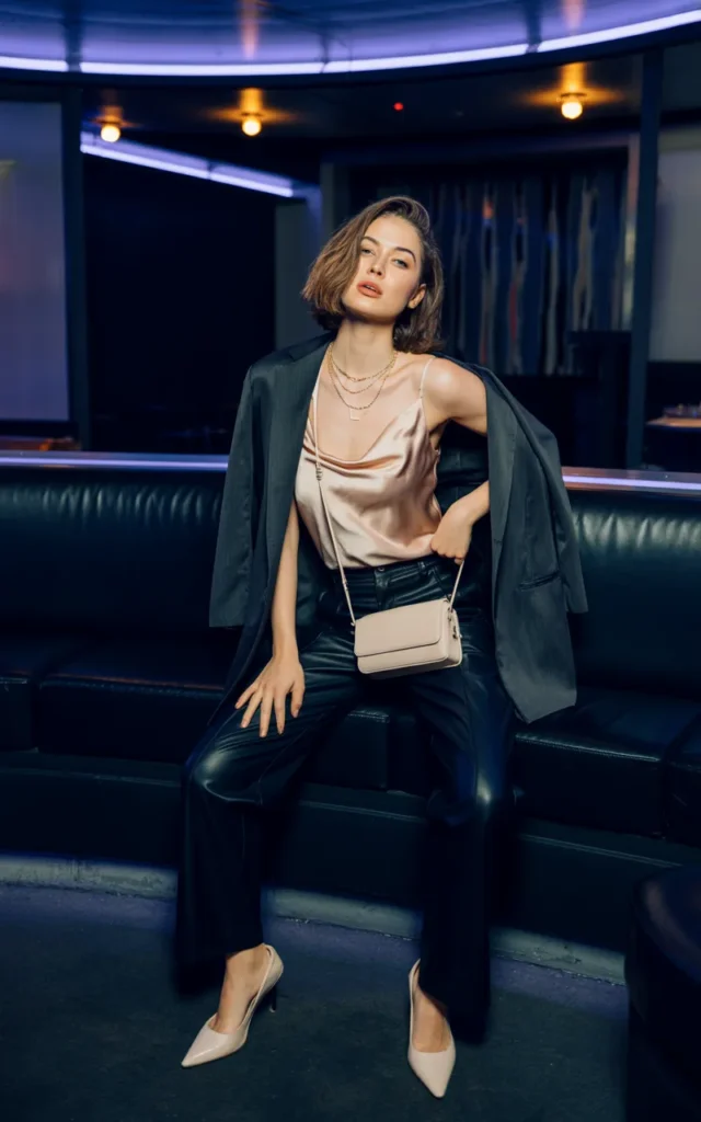 Pair a satin camisole with high-waisted leather pants.